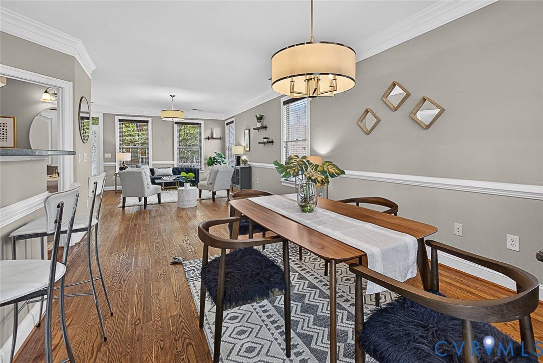 710 S Laurel Street, Oregon Hill, Richmond, VA 23220 Open-concept living space featuring hardwood flooring, crown molding, and a drum pendant light fixture