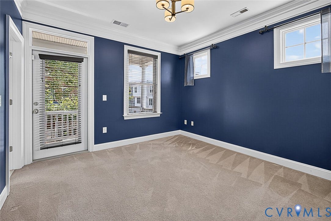 710 S Laurel Street, Oregon Hill, Richmond, VA 23220 Room featuring carpet flooring, blue walls, and white trim