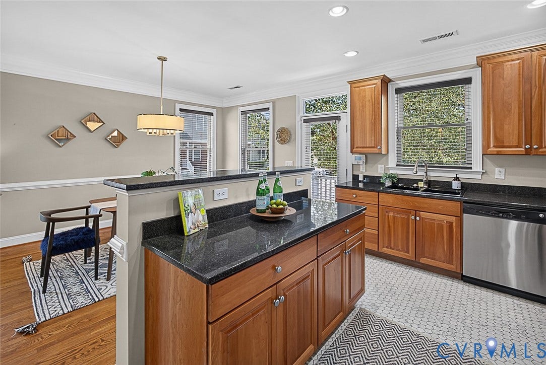710 S Laurel Street, Oregon Hill, Richmond, VA 23220 Kitchen featuring wood-finish cabinetry, dark stone countertops, and a stainless steel dishwasher