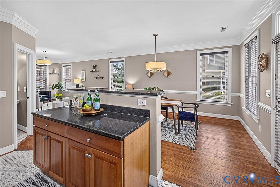 710 S Laurel Street, Oregon Hill, Richmond, VA 23220 Kitchen island featuring a dark countertop and wood cabinetry