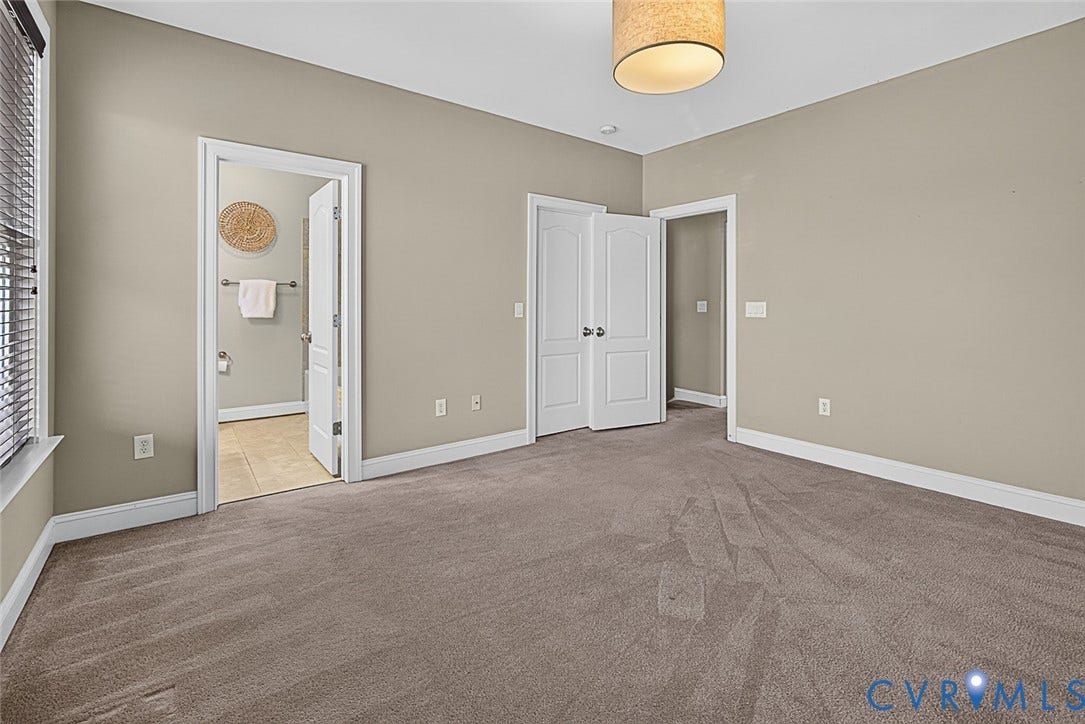 710 S Laurel Street, Oregon Hill, Richmond, VA 23220 Spacious room with plush carpet flooring, neutral wall tones, and white baseboards