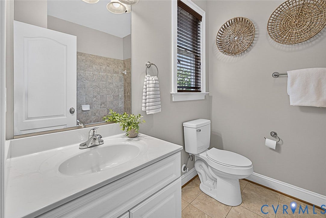 710 S Laurel Street, Oregon Hill, Richmond, VA 23220 Bathroom featuring a white vanity with integrated sink, tiled flooring, a window with horizontal blinds, and a neutral wall color