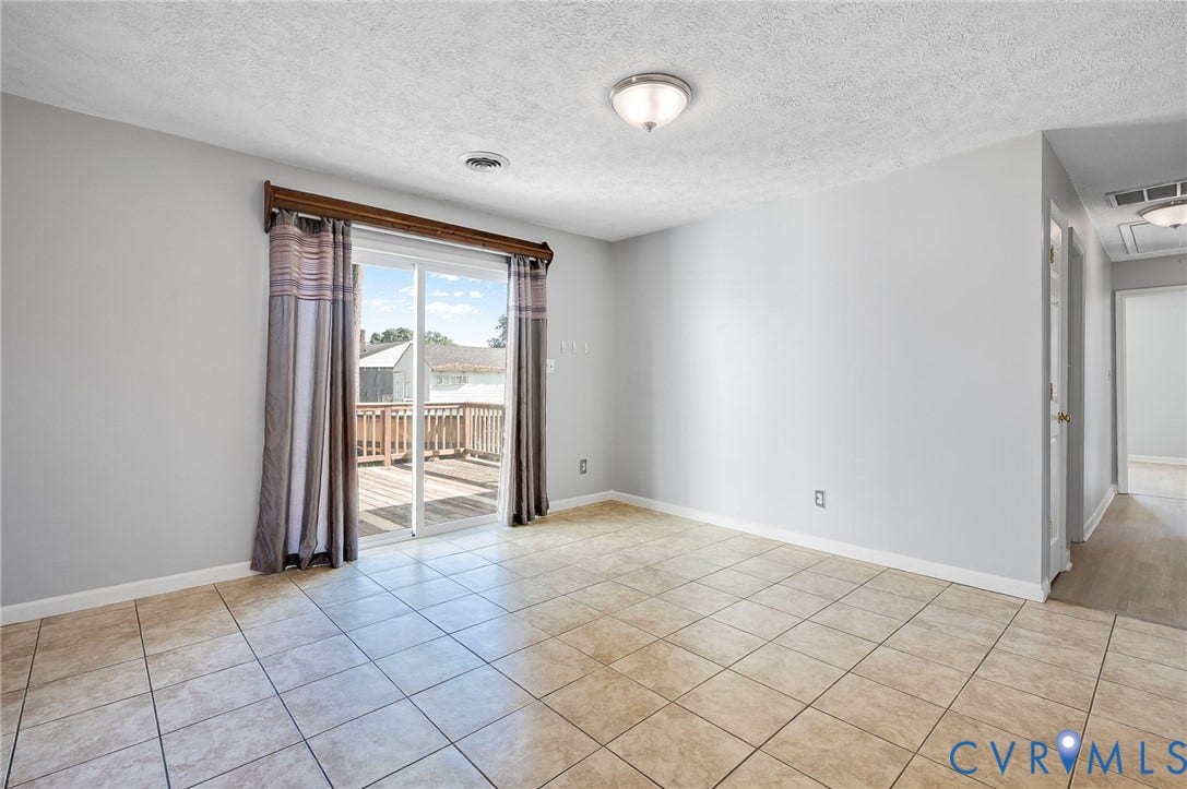 912 Williamsburg Road, Colonial Manor, Colonial Heights, VA 23834 Ceramic tile flooring, sliding glass door, and exterior wood deck