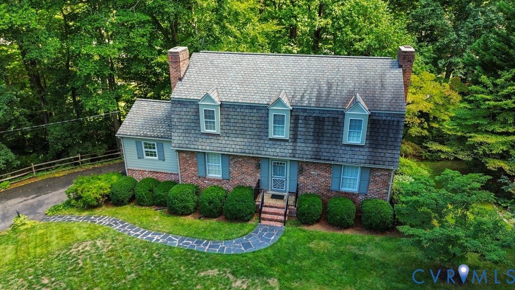 2425 Chancellor Road, North Chesterfield, VA 23235 Brick and siding exterior with a shingled roof and three dormer windows