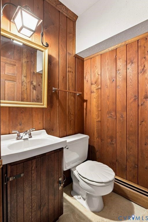 2425 Chancellor Road, North Chesterfield, VA 23235 Basement half bathroom. Wood-paneled walls with decorative trim