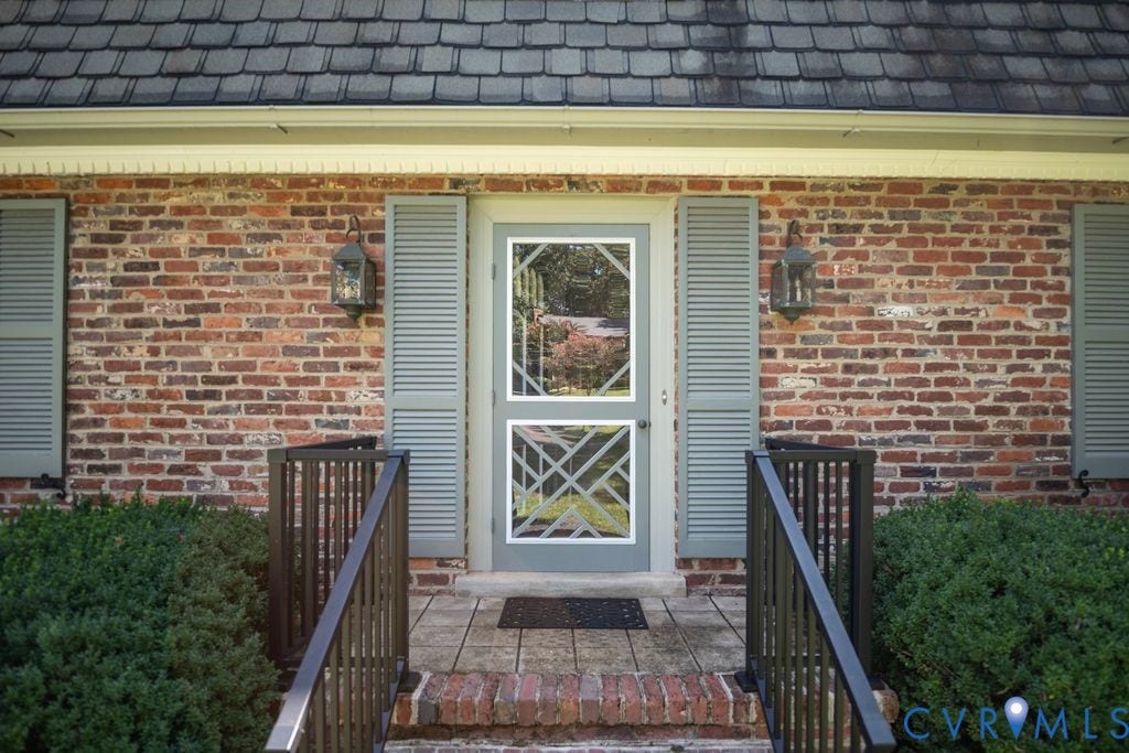 2425 Chancellor Road, North Chesterfield, VA 23235 Brick facade with shingled roof and decorative gutters
