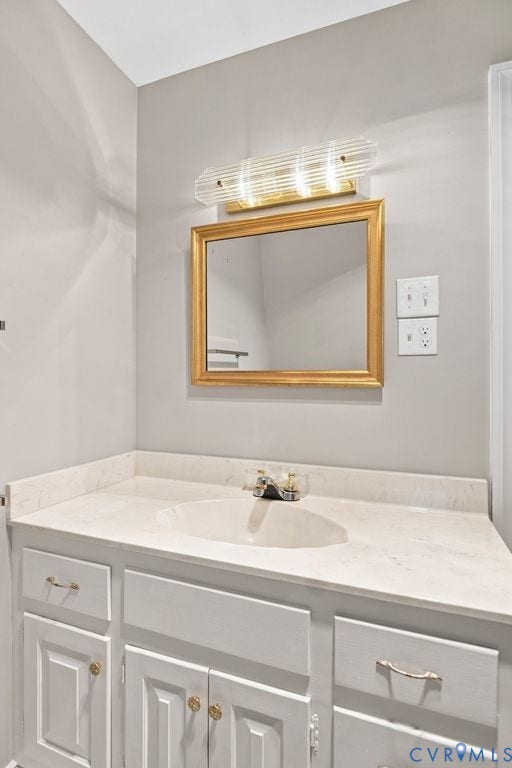 2425 Chancellor Road, North Chesterfield, VA 23235 2nd Floor Bathroom. White vanity with a light-toned countertop, undermount sink, and polished chrome faucet
