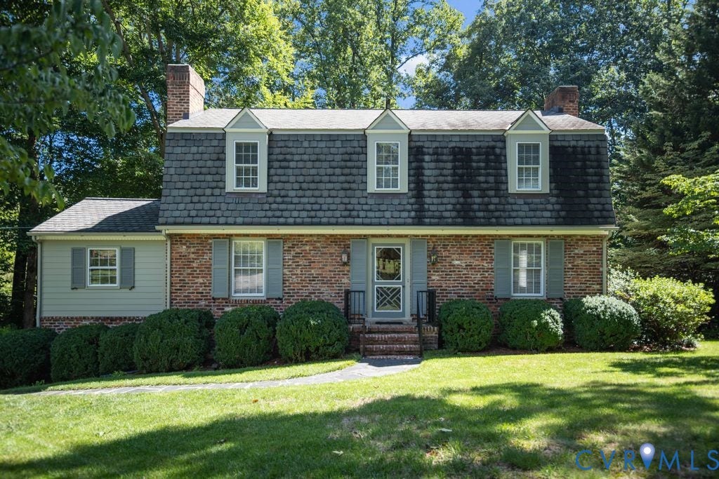 2425 Chancellor Road, North Chesterfield, VA 23235 Traditional brick exterior with dormer windows, a slate-shingle roof, and a mature treed setting