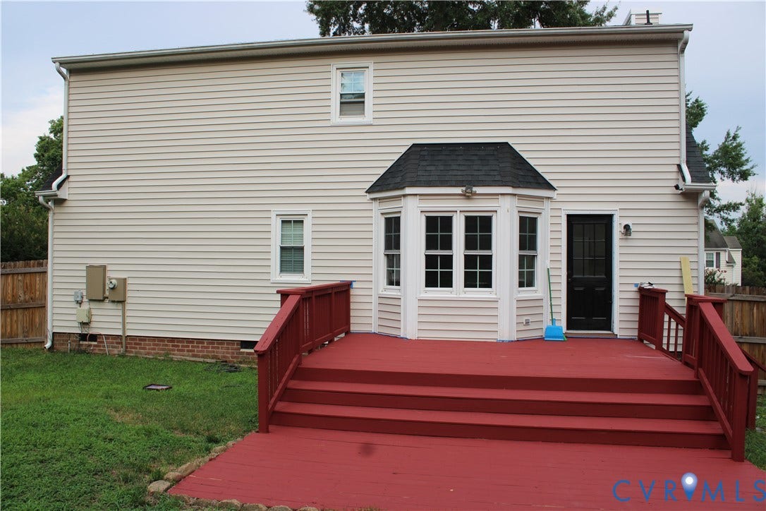 2120 Oakhampton Place, Henrico, VA 23233 Expansive red-stained deck with railing, providing outdoor access to the property