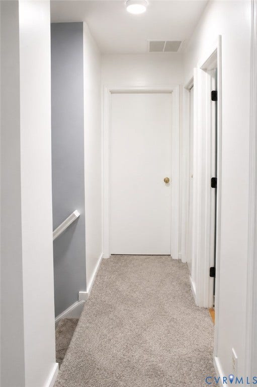 2120 Oakhampton Place, Henrico, VA 23233 Carpeted hallway featuring bright white walls, white trim, recessed lighting, and a white interior door with a brass-toned doorknob