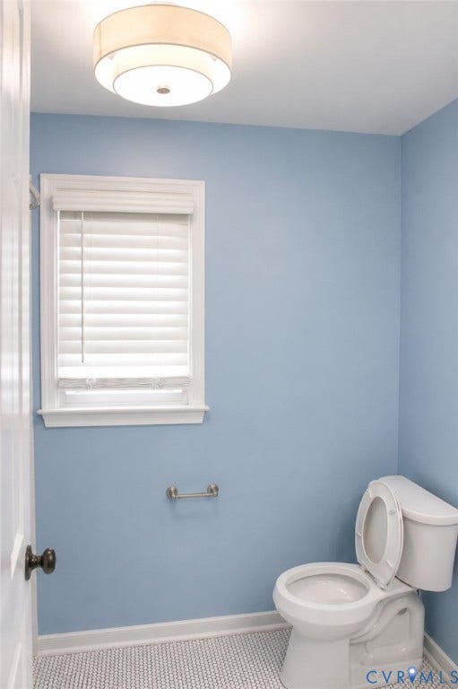 2120 Oakhampton Place, Henrico, VA 23233 Bathroom featuring a white toilet, light blue walls, and a window with white blinds