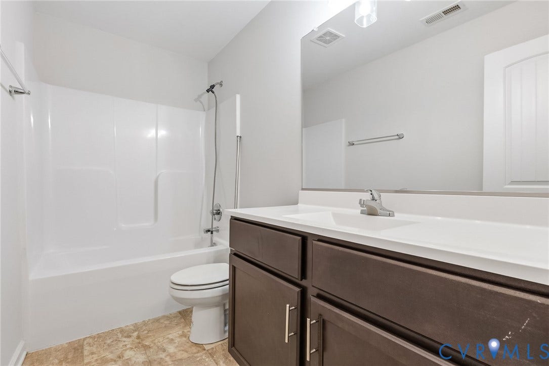 2007 Arcadia Avenue, Chester, VA 23831 Bathroom featuring a dark wood-finish vanity with a white countertop and integrated sink
