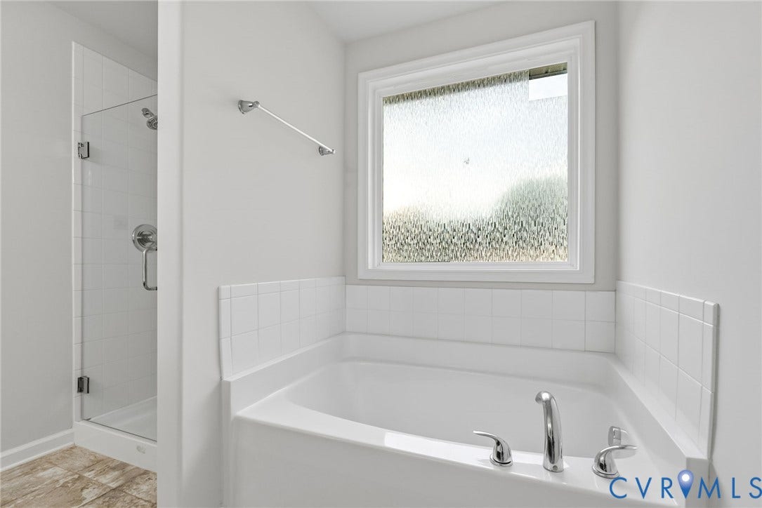 2007 Arcadia Avenue, Chester, VA 23831 Spacious bathing area featuring a corner garden tub with chrome fixtures and a privacy window