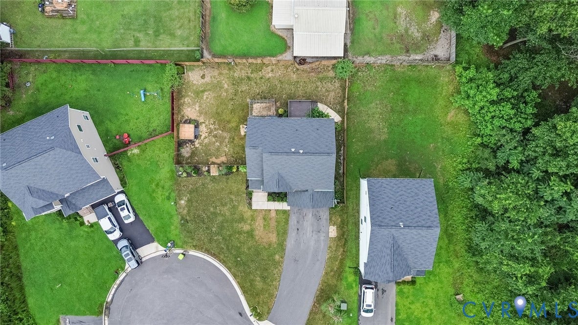 2007 Arcadia Avenue, Chester, VA 23831 Aerial view of a residential property with a dark shingle roof, a paved driveway, and established green space