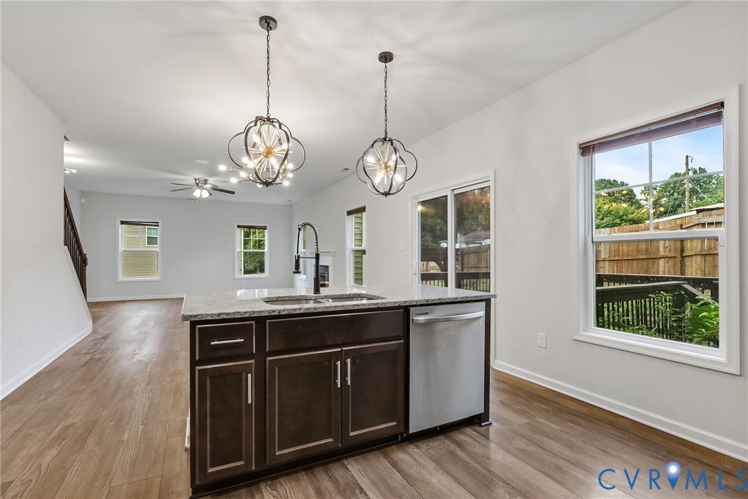 2007 Arcadia Avenue, Chester, VA 23831 Central kitchen island with granite-style countertop, integrated sink, and stainless steel dishwasher