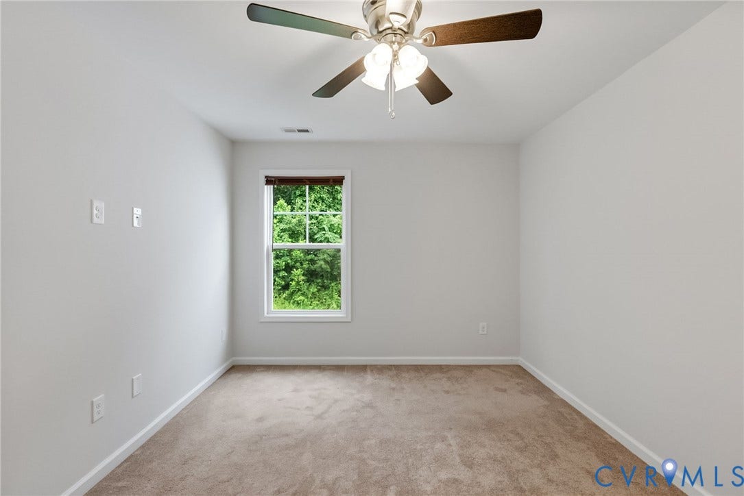 2007 Arcadia Avenue, Chester, VA 23831 Carpeted room with a double-hung window featuring a wood-tone blind