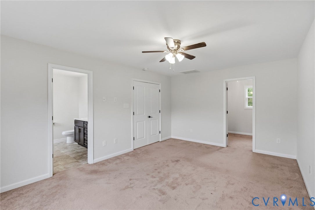 2007 Arcadia Avenue, Chester, VA 23831 Spacious room featuring neutral carpeting, light gray walls, a ceiling fan with integrated lighting, and multiple interior doorways