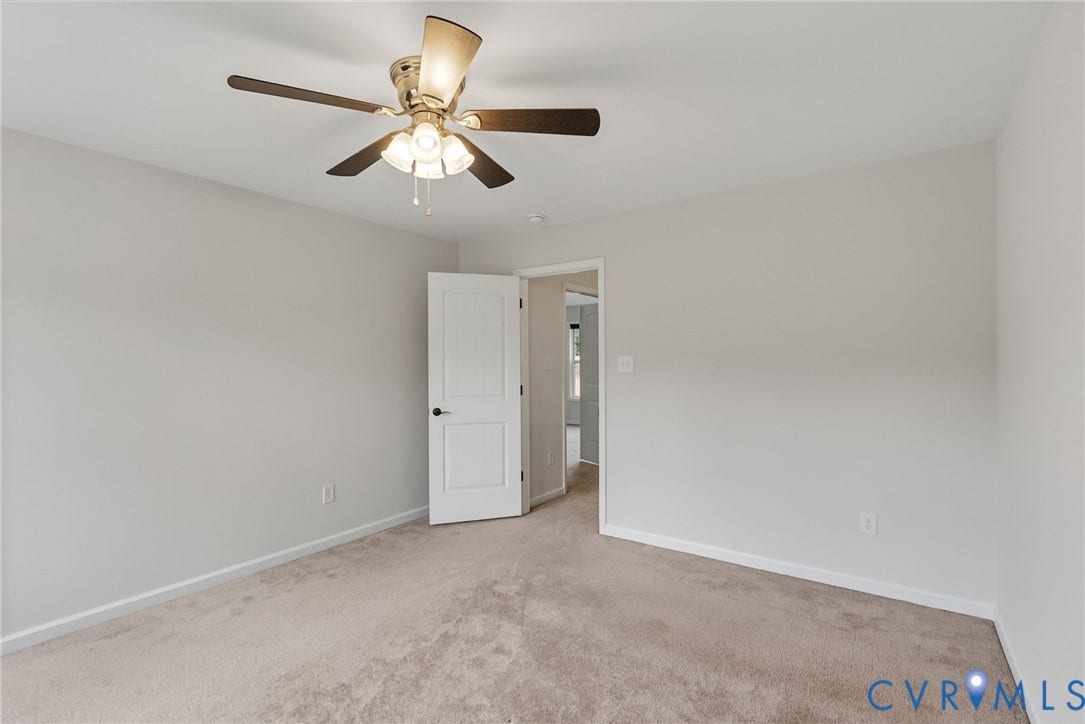 2007 Arcadia Avenue, Chester, VA 23831 Carpeted room with light neutral wall tones, a ceiling fan with integrated lighting, and a white interior door with a black knob