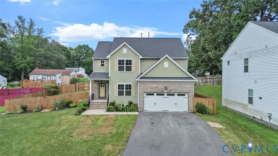 2007 Arcadia Avenue, Chester, VA 23831 Two-story residence featuring light green siding and a dark shingle roof
