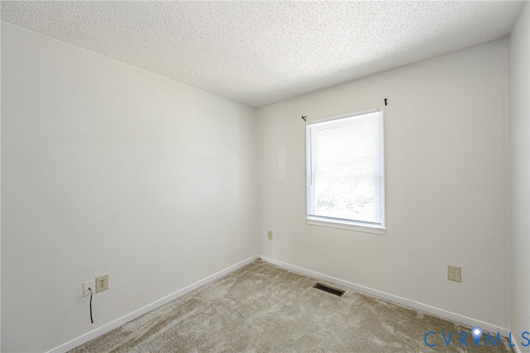 Neutral wall paint with textured ceiling
