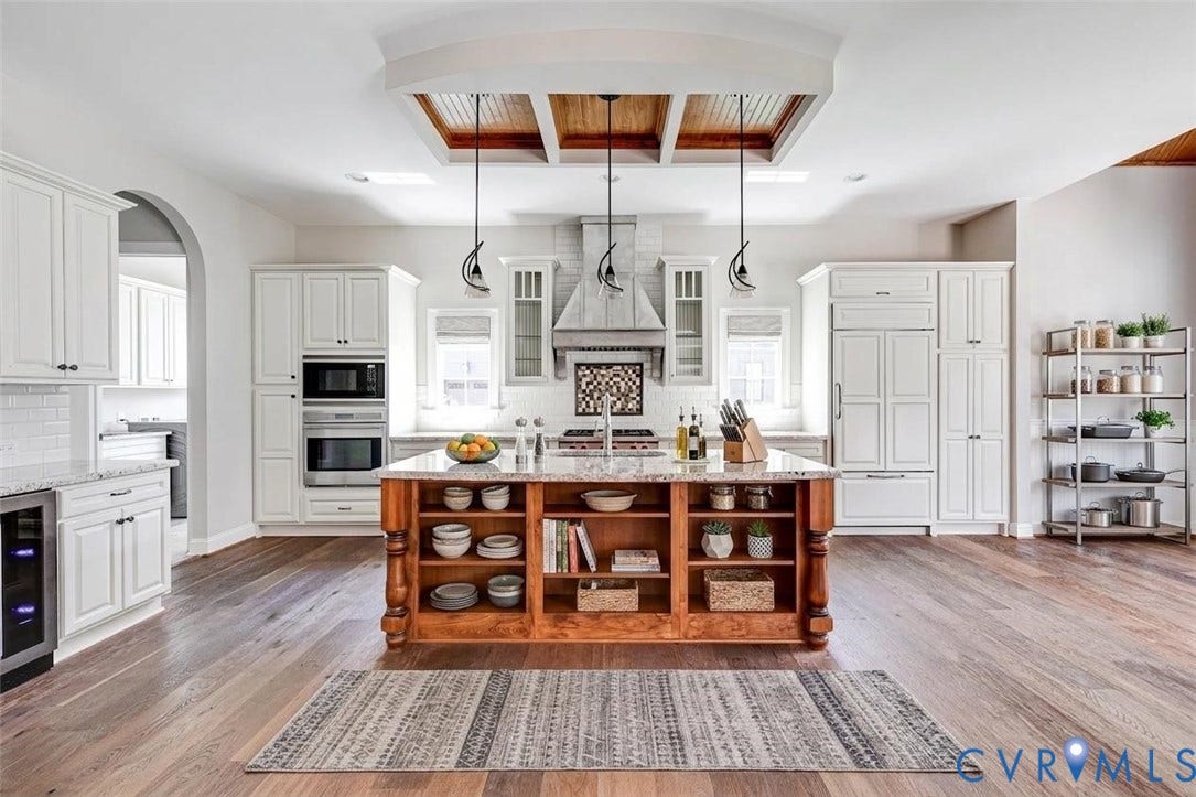 1978 Farnborough Drive, Midlothian, VA 23112 Gourmet kitchen featuring a large central island with seating, white cabinetry, wood-finish flooring, recessed lighting, and a coffered ceiling with wood paneling. Virtually Staged