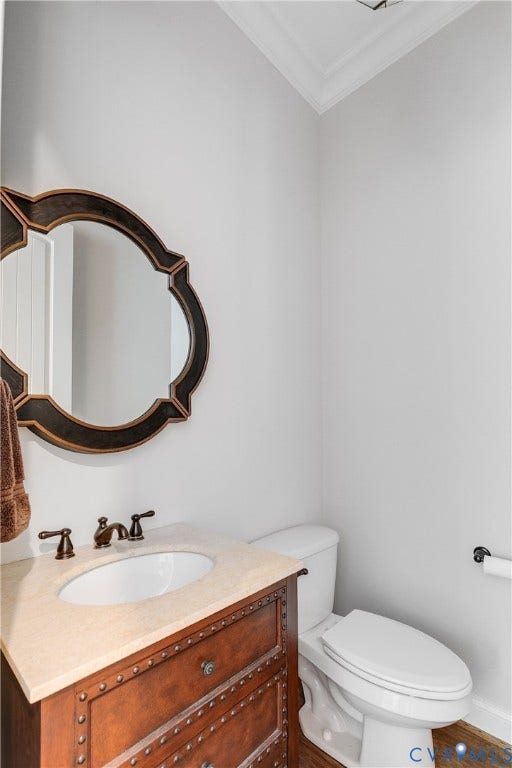 1978 Farnborough Drive, Midlothian, VA 23112 Powder room featuring a decorative bronze framed mirror, a vanity with a light-colored countertop and a white oval sink, and bronze faucet fixtures