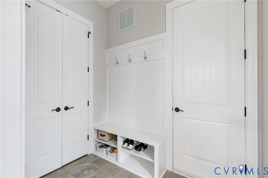 1978 Farnborough Drive, Midlothian, VA 23112 Built-in bench with storage shelving and wall-mounted coat hooks
