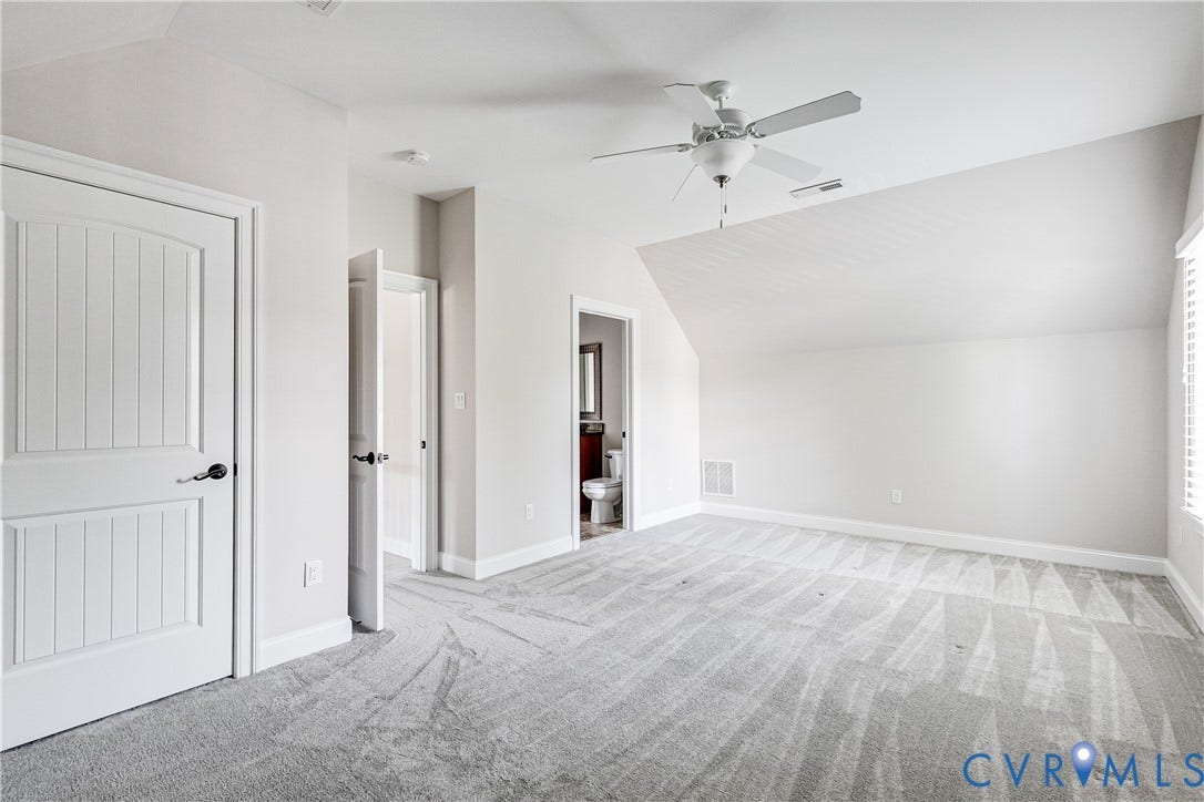 1978 Farnborough Drive, Midlothian, VA 23112 Carpeted room featuring a ceiling fan, sloped ceiling, and window with white trim