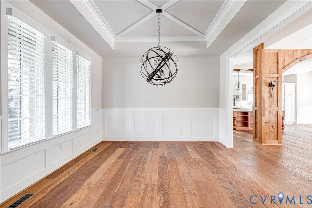 1978 Farnborough Drive, Midlothian, VA 23112 Dining area featuring hardwood flooring, a coffered ceiling, wainscoting, and a linear array of windows