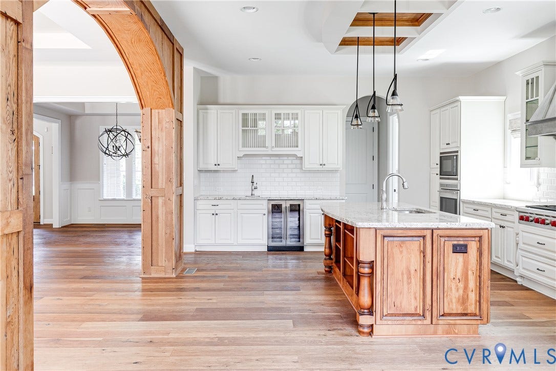1978 Farnborough Drive, Midlothian, VA 23112 Spacious kitchen featuring a central island with a light-toned countertop, white cabinetry, and pendant lighting