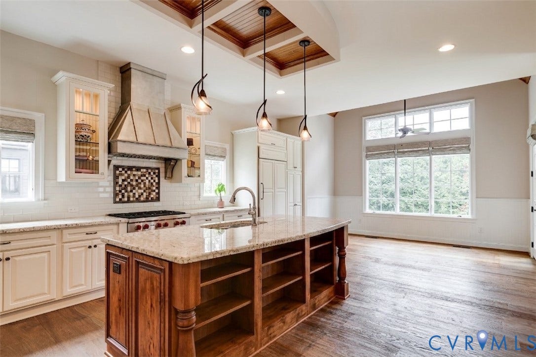 1978 Farnborough Drive, Midlothian, VA 23112 Gourmet kitchen featuring a large central island with seating, granite countertops, and a subway tile backsplash