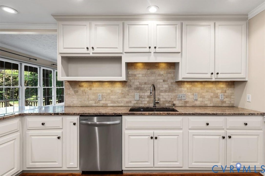 1437 Palmore Road, Powhatan, VA 23139 Kitchen featuring white shaker-style cabinetry, a stainless steel dishwasher, a dark basin sink with a gooseneck faucet, light-toned stone backsplash, and recessed lighting