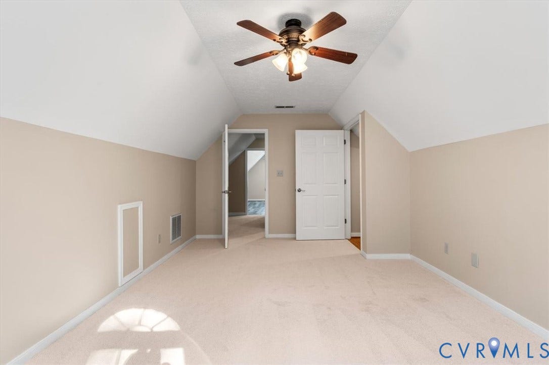 1437 Palmore Road, Powhatan, VA 23139 Carpeted room with a sloped ceiling and a ceiling fan with light fixture