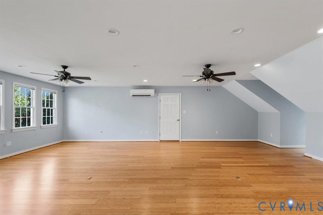 1437 Palmore Road, Powhatan, VA 23139 Spacious interior room featuring wood-finish flooring, light blue walls, and a white ceiling with recessed lighting