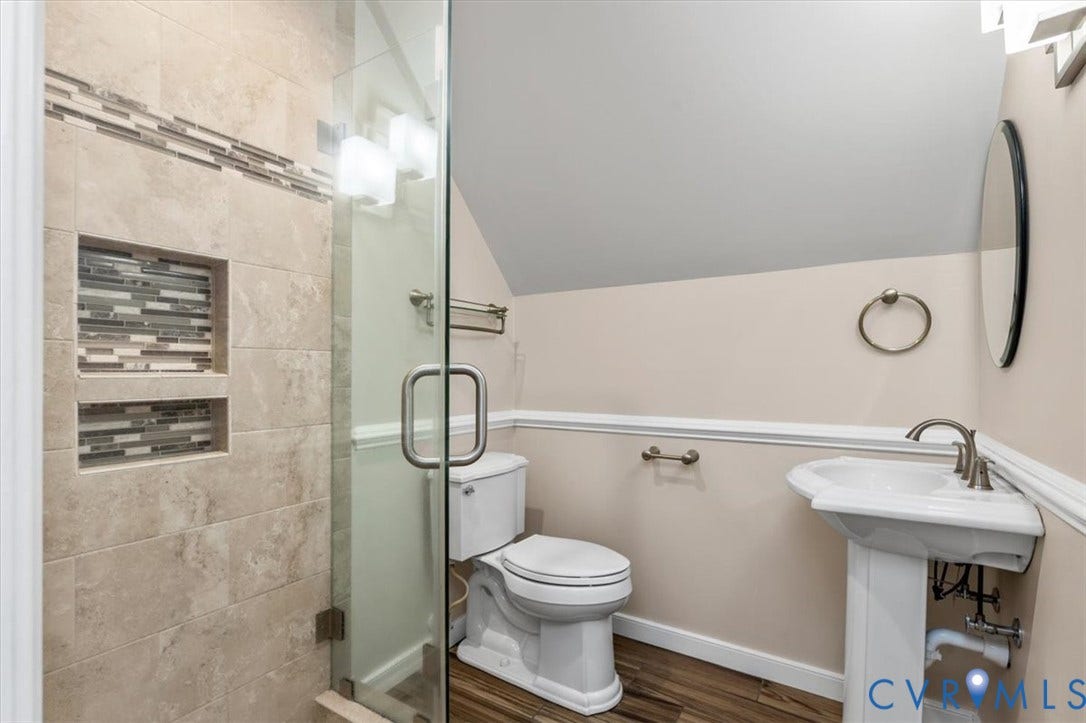 1437 Palmore Road, Powhatan, VA 23139 Three-quarter bathroom featuring a glass-enclosed shower with tiled walls, two integrated tiled niches, and linear mosaic accent banding