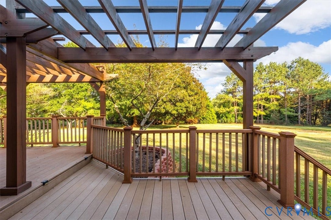 1437 Palmore Road, Powhatan, VA 23139 Expansive outdoor deck featuring a rich brown pergola