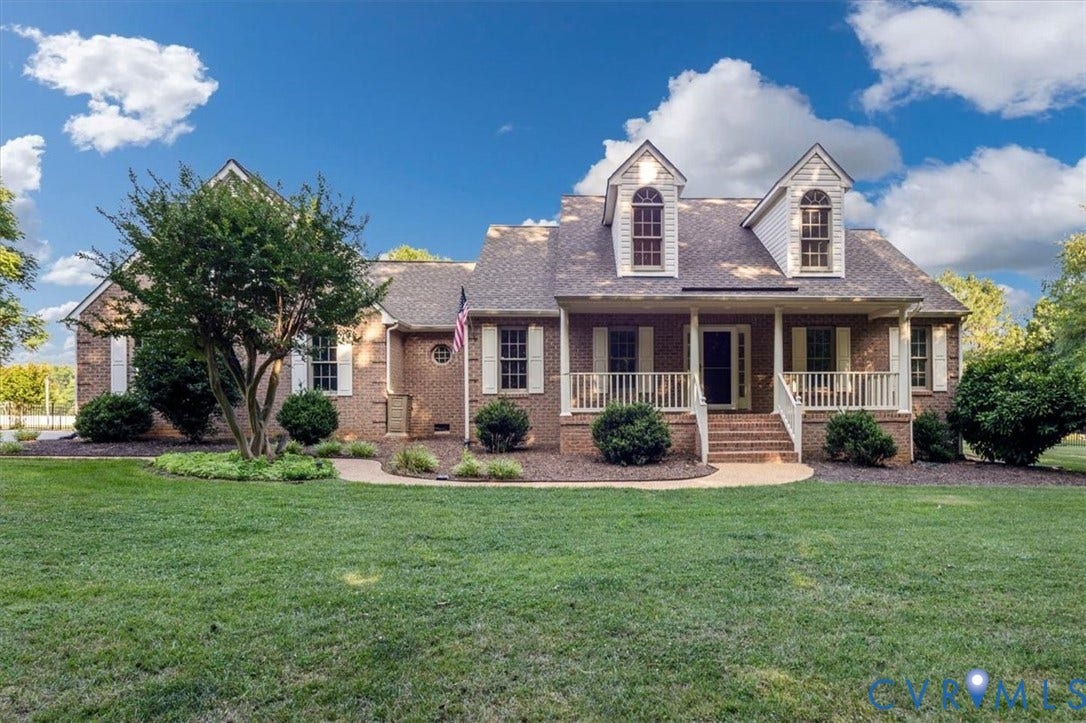 1437 Palmore Road, Powhatan, VA 23139 Brick exterior with white shutters and a covered front porch with white railings
