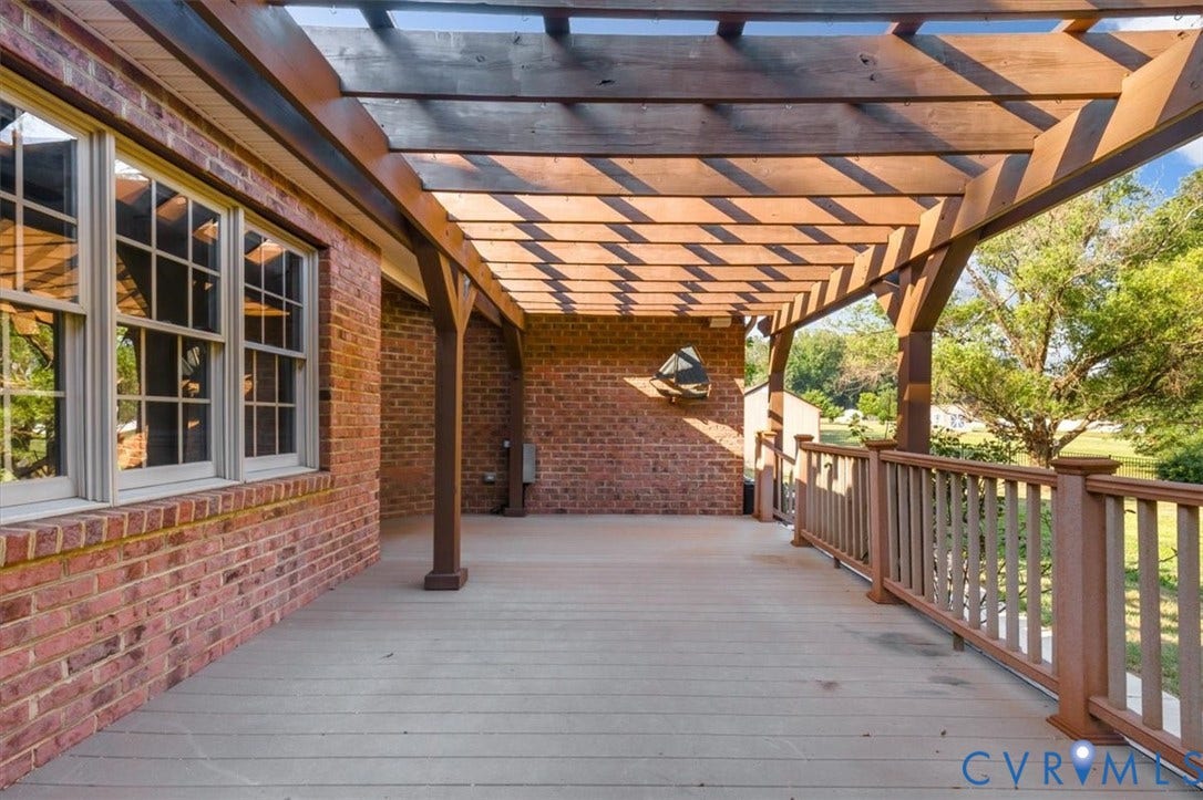 1437 Palmore Road, Powhatan, VA 23139 Outdoor deck featuring a wood-finish pergola, composite decking, and a railing system