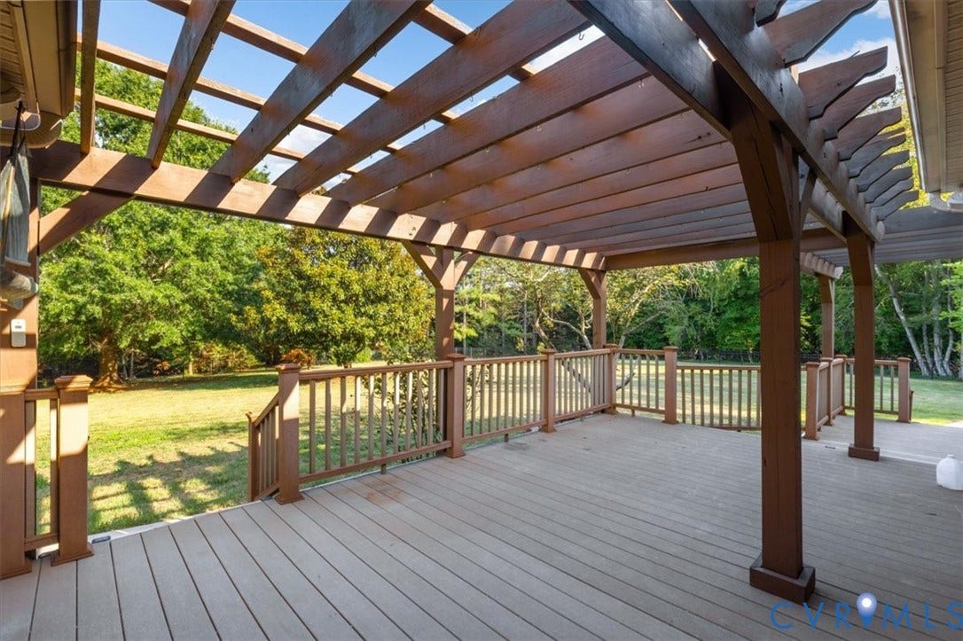 1437 Palmore Road, Powhatan, VA 23139 Expansive outdoor deck featuring a wood pergola and composite decking
