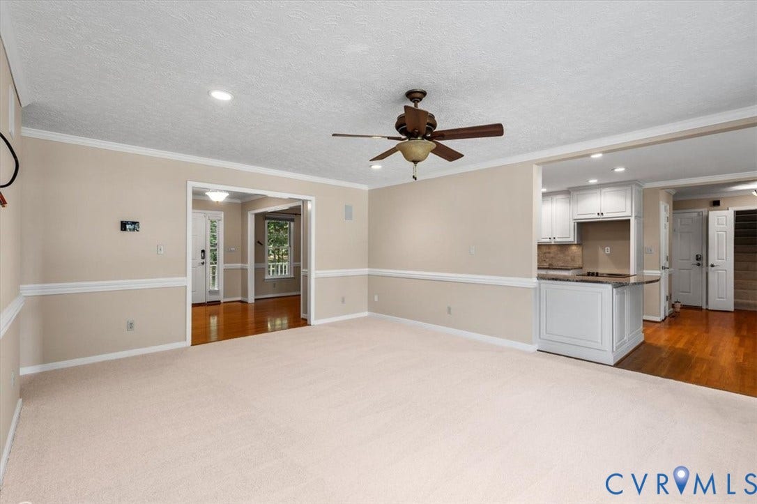 1437 Palmore Road, Powhatan, VA 23139 Spacious room featuring neutral carpeting and light beige walls with decorative chair rail molding