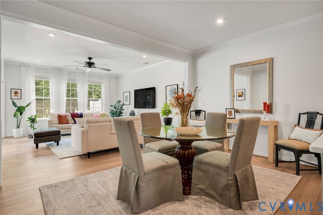 9217 Cerulean Place, Goochland, VA 23238 Open-concept living area with light wood-finish flooring, recessed lighting, and crown molding