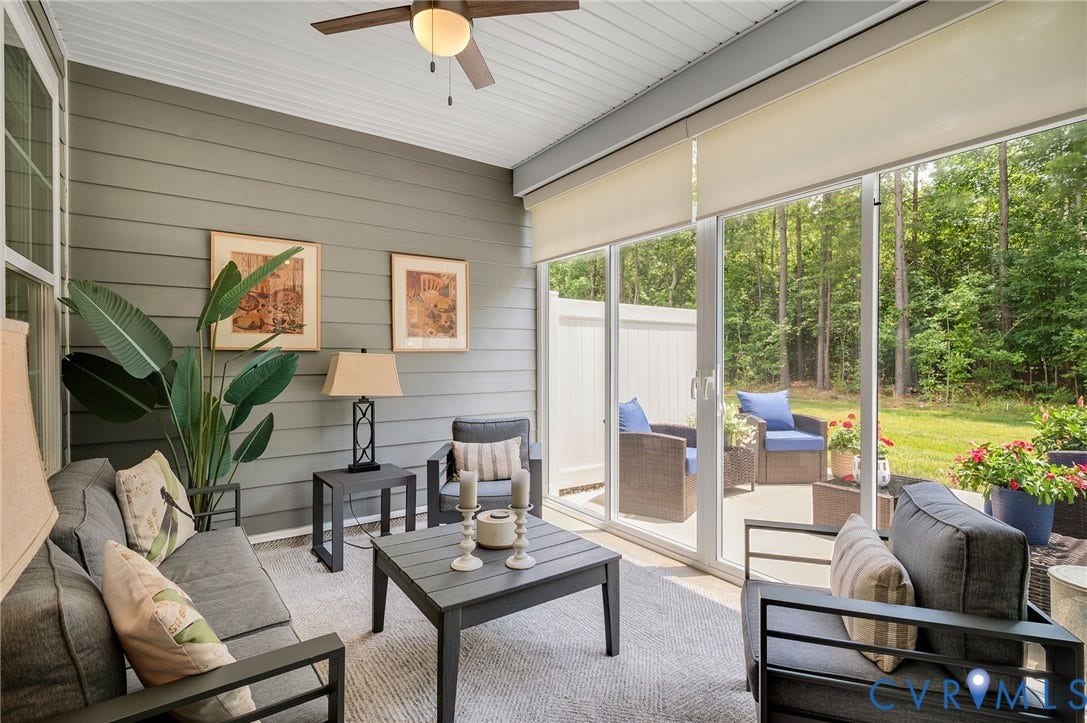 9217 Cerulean Place, Goochland, VA 23238 Screened porch featuring durable siding, a ceiling fan, and large sliding glass doors opening to a patio