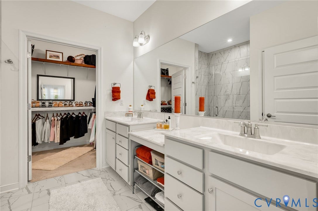 9217 Cerulean Place, Goochland, VA 23238 Bathroom featuring a dual vanity with white cabinetry and marble-finish countertops