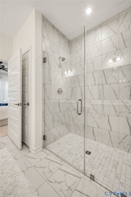 9217 Cerulean Place, Goochland, VA 23238 Glass-enclosed shower featuring white-veined tile walls and a mosaic tile floor