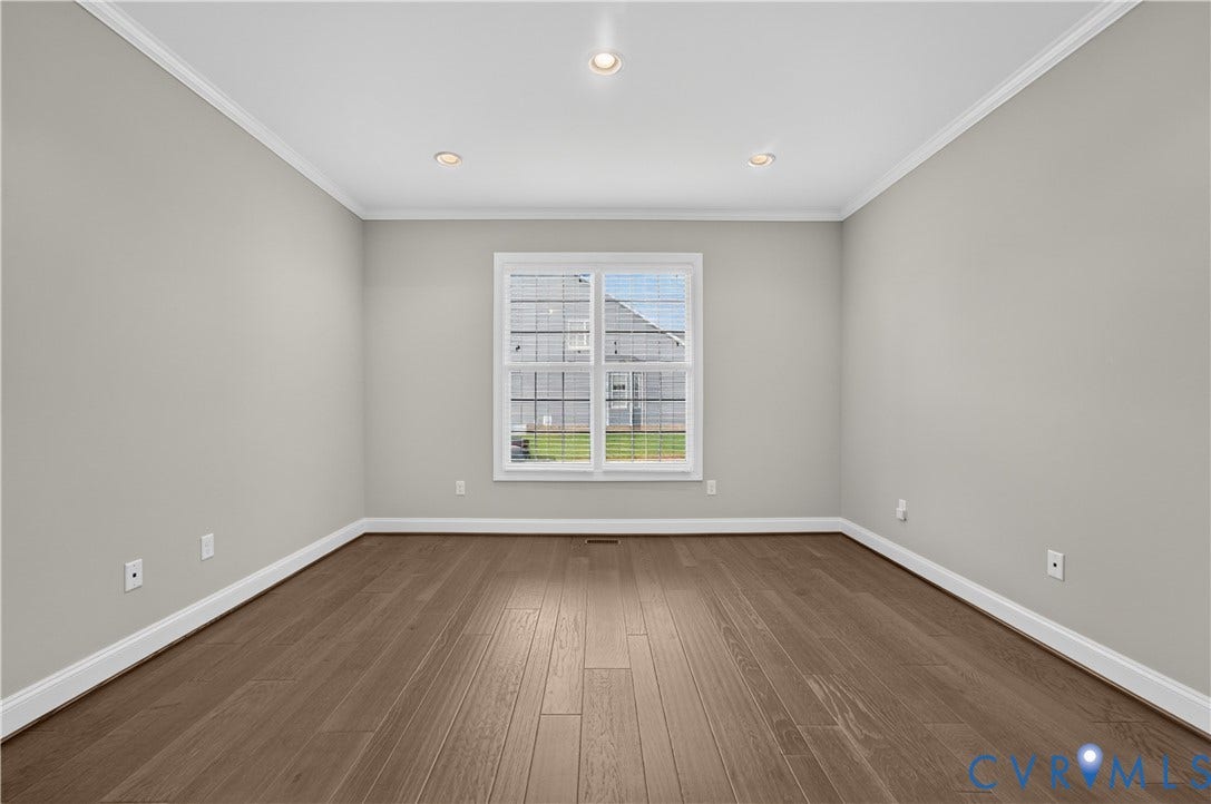 7238 Shenfield Avenue, Minutes To Short Pump, Glen Allen, VA 23059 Interior room featuring wood-finish flooring, light gray walls, and white crown molding