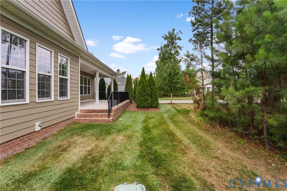 7238 Shenfield Avenue, Minutes To Short Pump, Glen Allen, VA 23059 Covered porch with white columns, brick stairs, and black metal railing