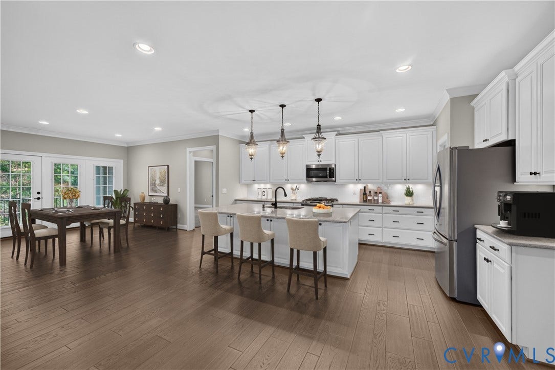 7238 Shenfield Avenue, Minutes To Short Pump, Glen Allen, VA 23059 Kitchen featuring white cabinetry, stainless steel appliances, a center island with pendant lighting, and wood-finish flooring