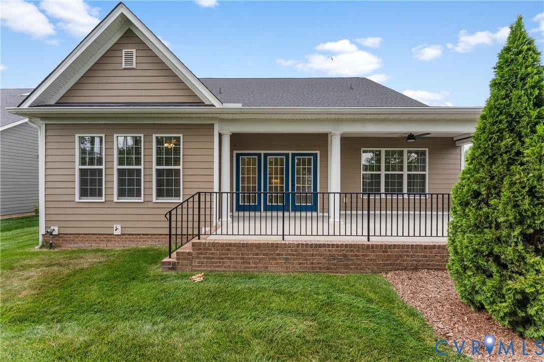 7238 Shenfield Avenue, Minutes To Short Pump, Glen Allen, VA 23059 Rear exterior featuring a covered patio, brick foundation, tan siding, and a gabled roofline
