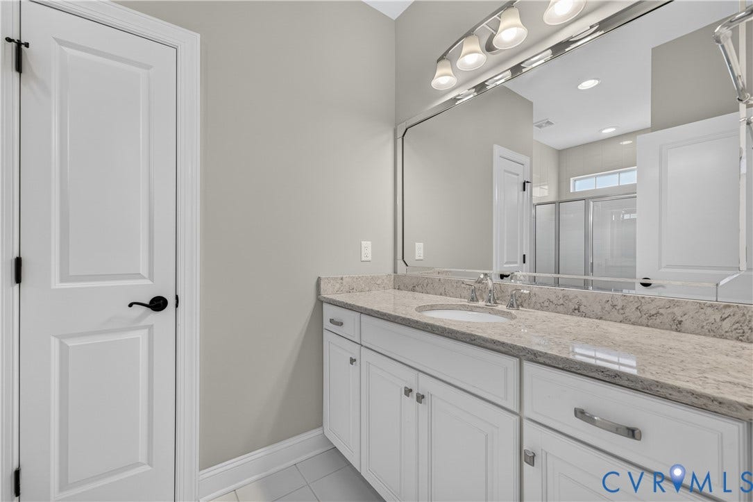 7238 Shenfield Avenue, Minutes To Short Pump, Glen Allen, VA 23059 Double vanity with integrated sinks, light-toned stone countertop, and chrome fixtures