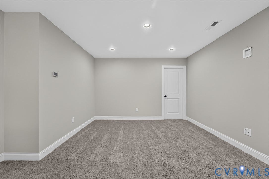 7238 Shenfield Avenue, Minutes To Short Pump, Glen Allen, VA 23059 Spacious room featuring neutral carpeting, light gray walls, white trim, recessed ceiling lighting, and a white two-panel door